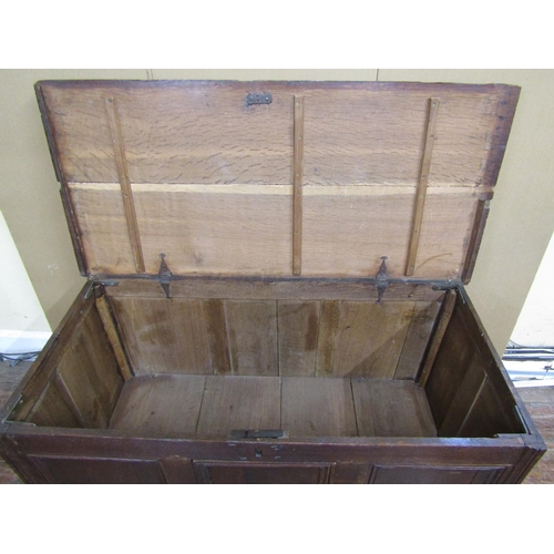 1567 - A Georgian oak mule chest with rising lid, the front elevation with three panels over a single friez... 