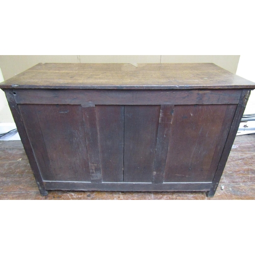 1567 - A Georgian oak mule chest with rising lid, the front elevation with three panels over a single friez... 