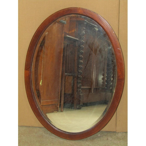 1244 - A Victorian mahogany Pembroke table on turned supports, an oval inlaid Edwardian wall mirror and an ... 