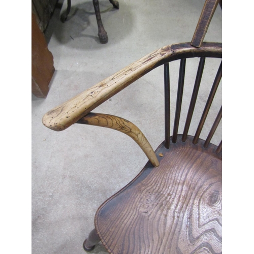 1383 - A 19th century Windsor hoop and stick back armchair, principally in elm and ash with pierced fruitwo... 