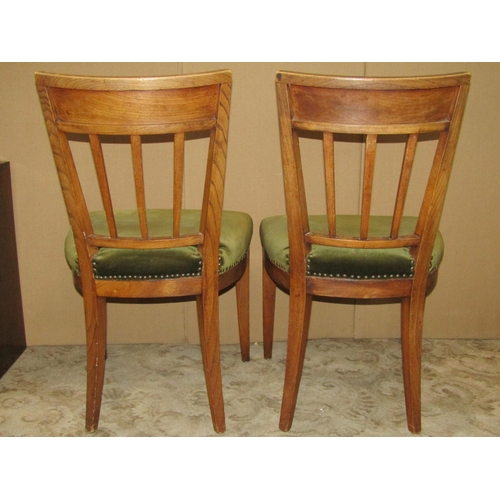 1390 - A set of six 19th century stick back chairs in elm with brass inlay, upholstered seats on swept supp... 