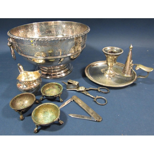 169 - A silver plated fruit bowl with lion mask handles 21cm diam, a silver plated chamber stick , wick sc... 