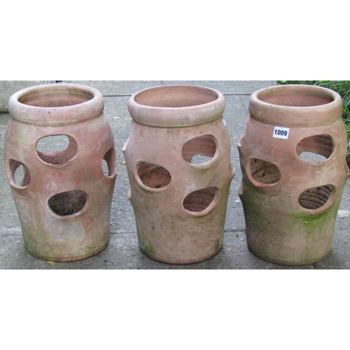 1009 - Three weathered terracotta baluster shaped strawberry planters with moulded collars, 36 cm high x 25... 