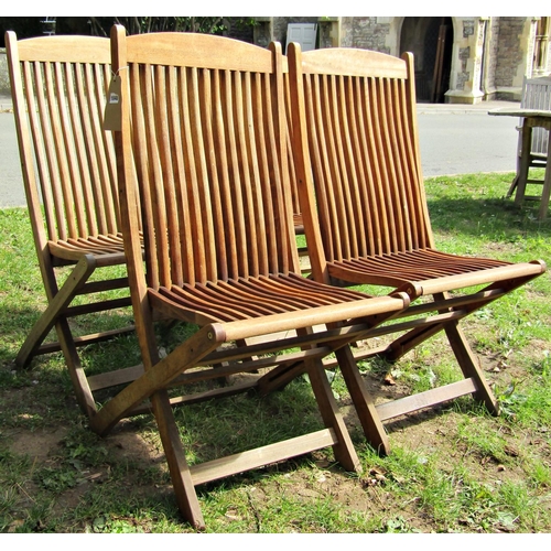 1048 - A set of four good quality contemporary folding hardwood garden chairs with slender slatted seats an... 
