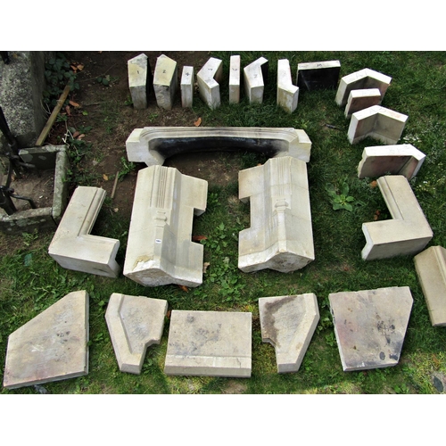 1061 - A Minster type sectional stone fireplace, (mainly dismantled for ease of removal and carriage)