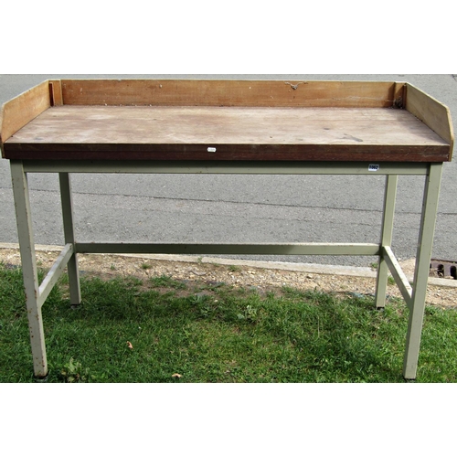 1062 - An ex laboratory work table of rectangular form with hardwood top, raised on a painted square tubula... 