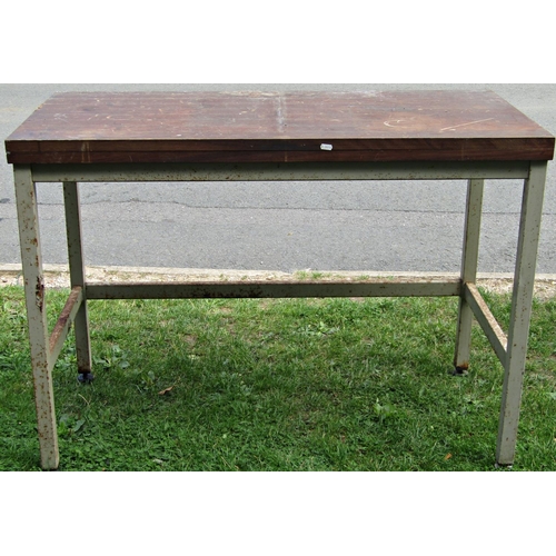 1062 - An ex laboratory work table of rectangular form with hardwood top, raised on a painted square tubula... 