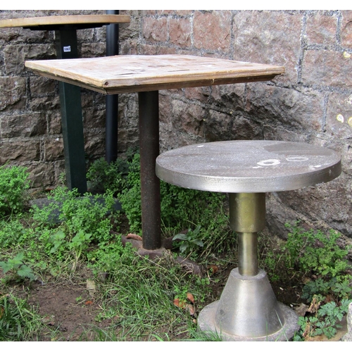 1063 - Two café or bistro tables of varying size and design, both with stripped wooden tops, together with ... 