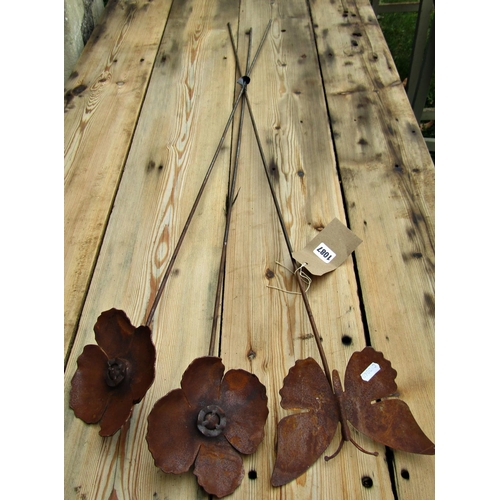 1087 - Three ornamental heavy gauge steel border stakes, one with floating butterfly finial, the other popp... 