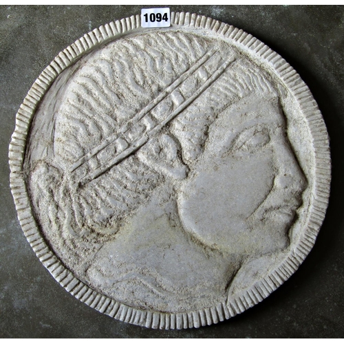 1094 - A carved natural stone roundel/portrait plaque, male character, 34cm diameter