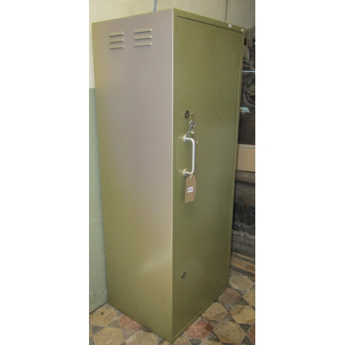 1111 - A light sage green painted heavy gauge steel floorstanding gun cabinet enclosed by a full length rec... 