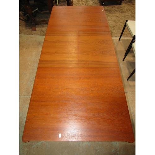 1203 - An A H Mackintosh & Co Ltd of Kirkaldy, Scotland teak pull out extending dining table with additiona... 