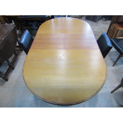 1204 - A G plan teak D end pull-out extending dining table with single additional bi-folding leaf raised on... 