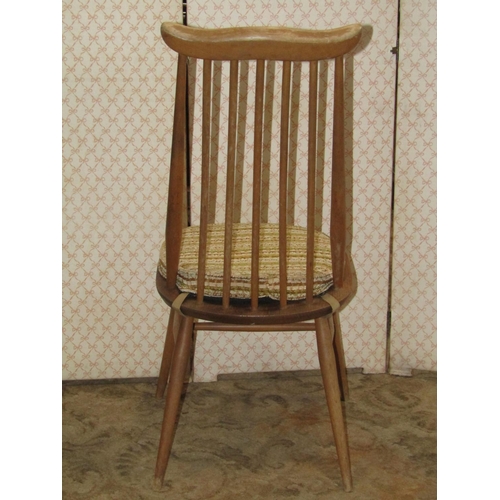 1211 - A set of four Ercol stained elm and beechwood high stick back dining  chairs with cow horn rails, ra... 