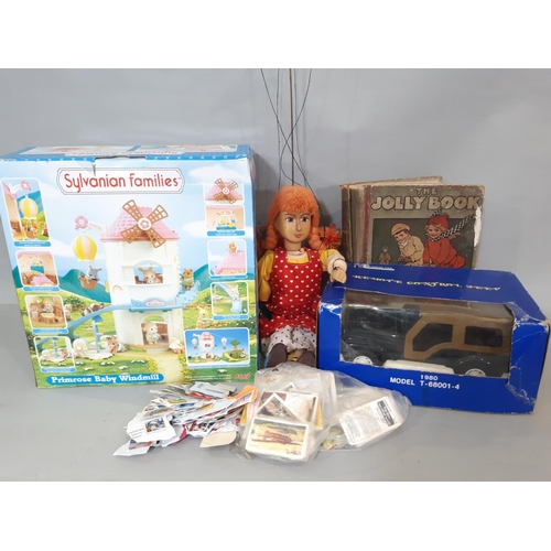 565 - Mixed toy lot including Sylvanian Families 'Primrose Baby Windmill' (unchecked), wooden puppet in cl... 