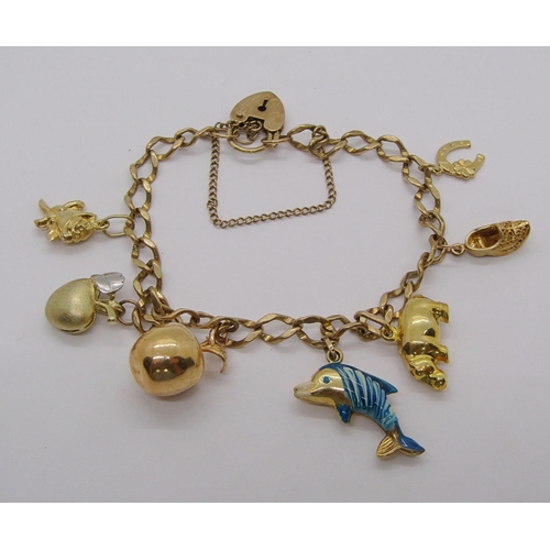 231 - 9ct curb link charm bracelet with heart padlock clasp, hung with seven novelty charms to include an ... 