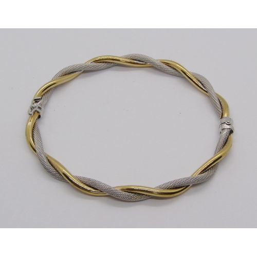 241 - 9ct bi-colour twisted hinged bangle, 4.7g