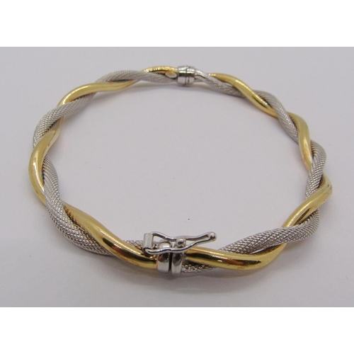 241 - 9ct bi-colour twisted hinged bangle, 4.7g