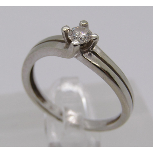 267 - 14ct white gold diamond solitaire crossover ring, 0.20cts approx, size L, 2.2g