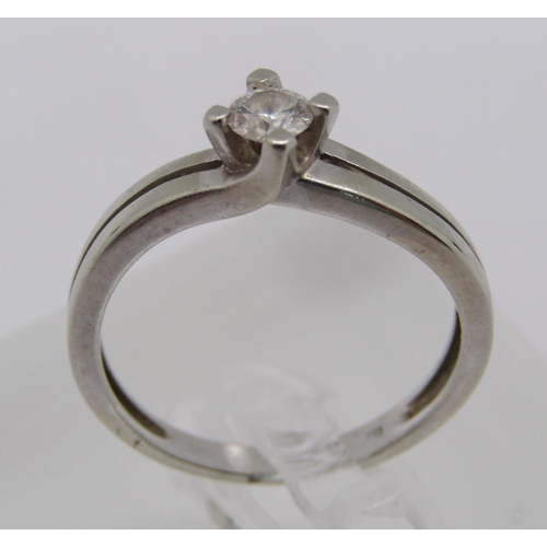 267 - 14ct white gold diamond solitaire crossover ring, 0.20cts approx, size L, 2.2g