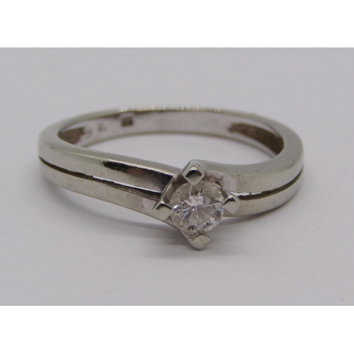 267 - 14ct white gold diamond solitaire crossover ring, 0.20cts approx, size L, 2.2g