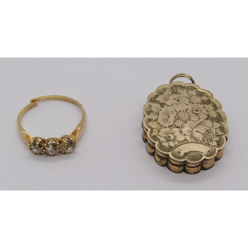 278 - 18ct three stone old-cut diamond ring, 2.4g (shank cut) and a Victorian gilt metal locket with engra... 