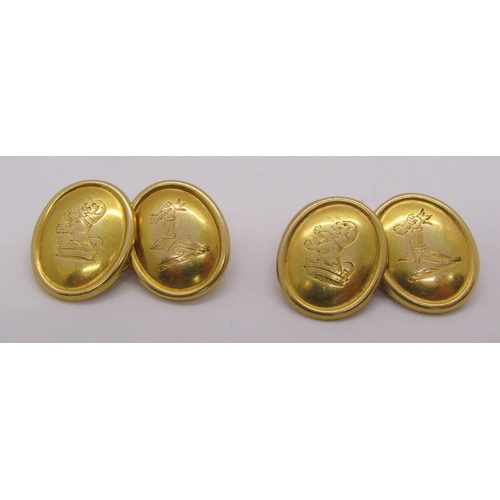 284 - Pair of antique yellow metal cufflinks with engraved crests, 10.9g