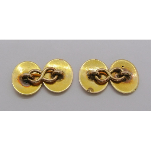 284 - Pair of antique yellow metal cufflinks with engraved crests, 10.9g