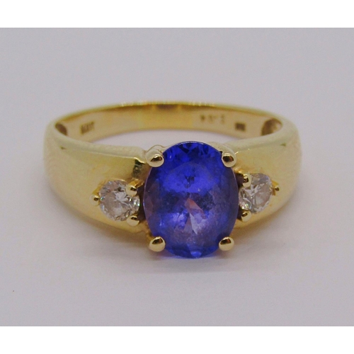 298 - 14ct tanzanite and diamond three stone dress ring, size S, stamped 'HOT' to interior, 4g, with accom... 