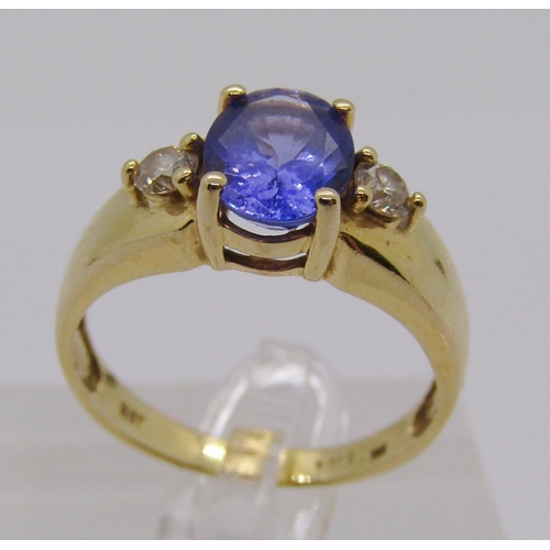 298 - 14ct tanzanite and diamond three stone dress ring, size S, stamped 'HOT' to interior, 4g, with accom... 