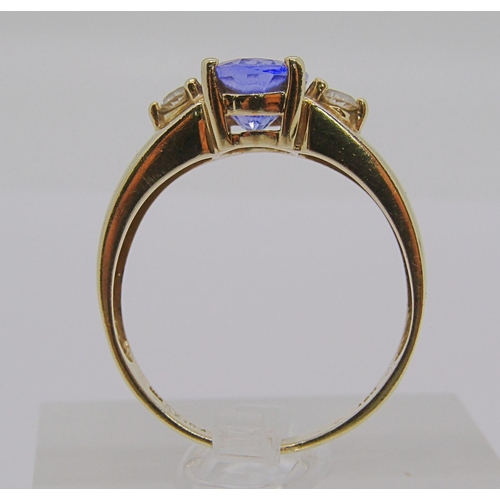 298 - 14ct tanzanite and diamond three stone dress ring, size S, stamped 'HOT' to interior, 4g, with accom... 