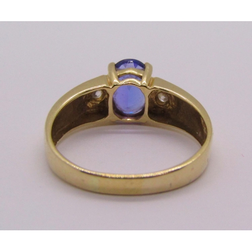 298 - 14ct tanzanite and diamond three stone dress ring, size S, stamped 'HOT' to interior, 4g, with accom... 