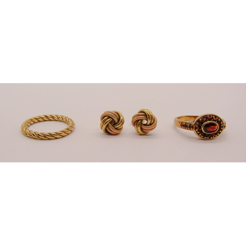 303 - Group of 9ct jewellery comprising a twist ring, size L/M, further garnet cluster ring, size O and a ... 