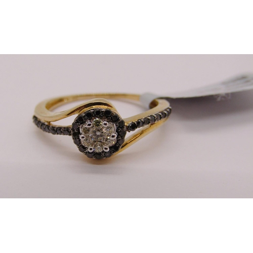 306 - 9ct black and white diamond crossover type ring, size L/M and a further 9ct cubic zirconia example, ... 