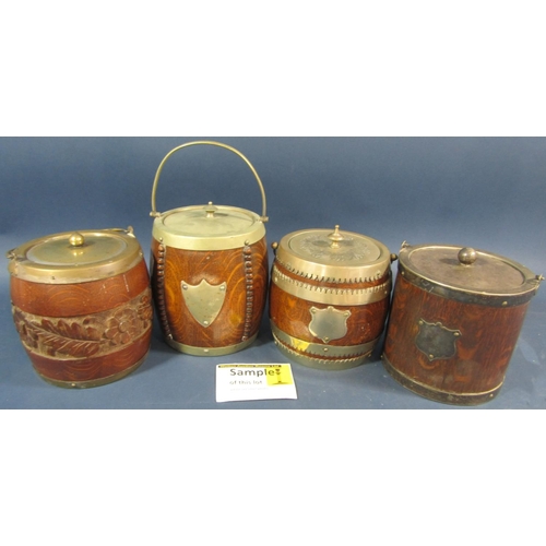 174 - An Edwardian oak fruit bowl with china liner, and four similar oak biscuit barrels.