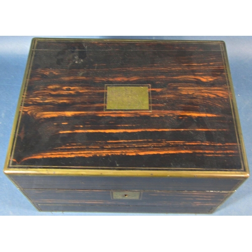 175 - A mid Victorian period coromandel wood and brass banded travelling box, the rising lid fitted with t... 