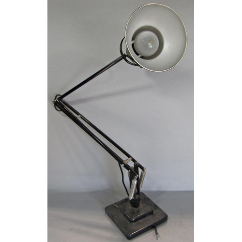 692 - A mid 20th century black Anglepoise lamp on a stepped base, stamped Made in England, Herbert Terry &... 