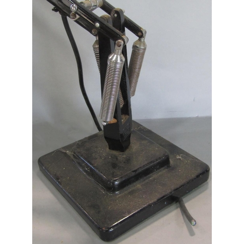 692 - A mid 20th century black Anglepoise lamp on a stepped base, stamped Made in England, Herbert Terry &... 