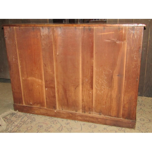 1440 - A Victorian mahogany side cupboard enclosed by a pair of arched and panelled doors, 110cm wide x 75c... 