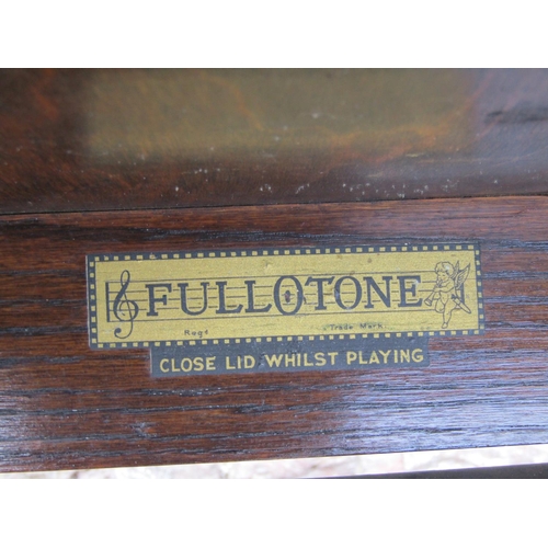 1446 - A Fullerton oak cased floor standing gramophone