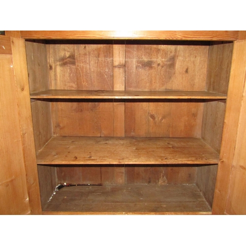 1231 - A reclaimed stripped pine cottage dresser, the base enclosed by a pair of rectangular panelled doors... 