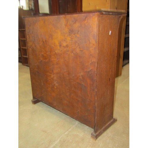 1238 - An oak Arts & Crafts style side cupboard, freestanding and enclosed by a pair of rectangular panelle... 