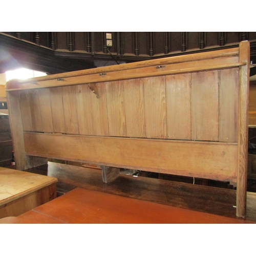 1259 - A pitch pine church pew with shaped ends, tongue and groove panelled back with plank seat, 188 cm lo... 