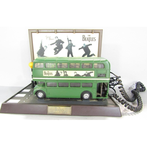 788 - Beatles memorabilia in the form of green No 77 double decker bus telephone stopped in front of The A... 