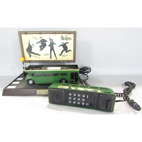 788 - Beatles memorabilia in the form of green No 77 double decker bus telephone stopped in front of The A... 