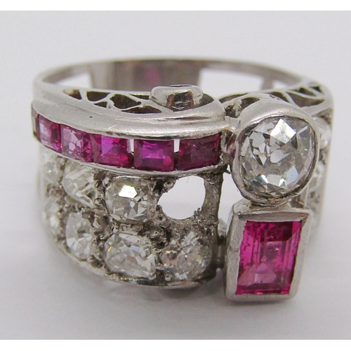 305 - Impressive vari-cut diamond and ruby cocktail ring with raised scrolled setting, largest diamond 0.4... 