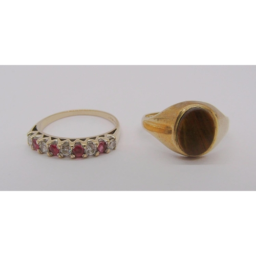 312 - 9ct tigers eye ring, size L and a further 9ct half hoop ring set with rubies, 3.8g total