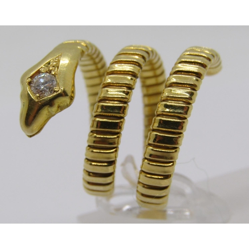 316 - Yellow metal novelty ring in the form of a coiled snake, the head set with a 0.15ct diamond, flexibl... 