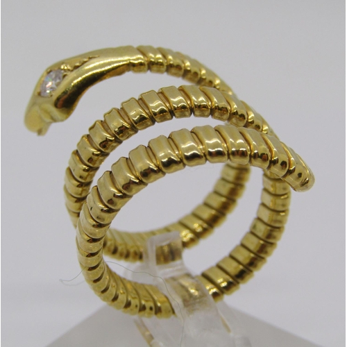 316 - Yellow metal novelty ring in the form of a coiled snake, the head set with a 0.15ct diamond, flexibl... 