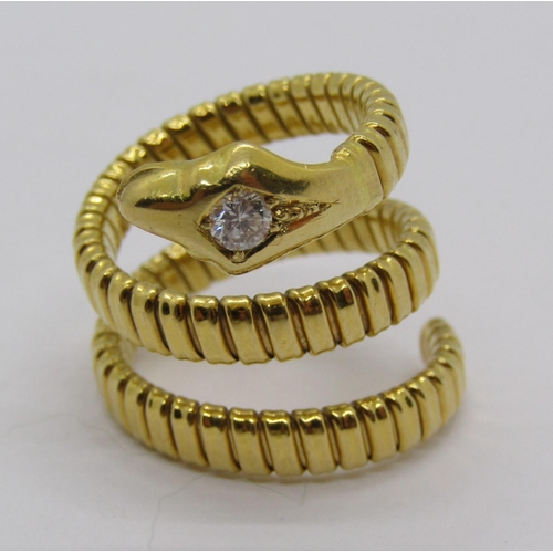 316 - Yellow metal novelty ring in the form of a coiled snake, the head set with a 0.15ct diamond, flexibl... 